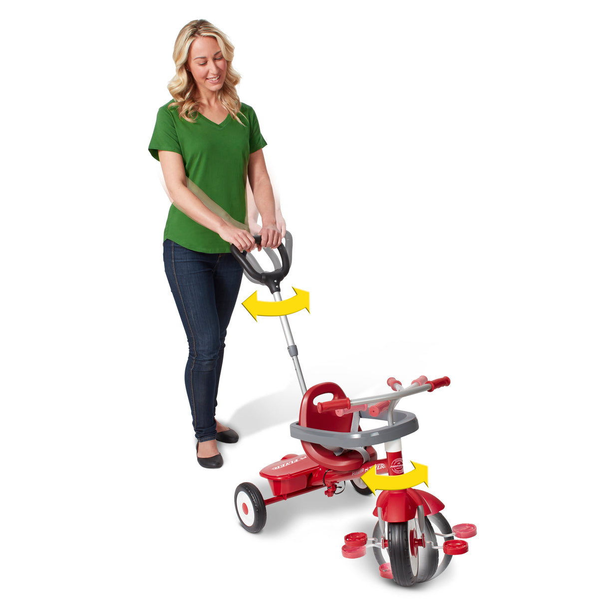 Woman turning the push handle of a red tricycle showing how the push handle steers the trike