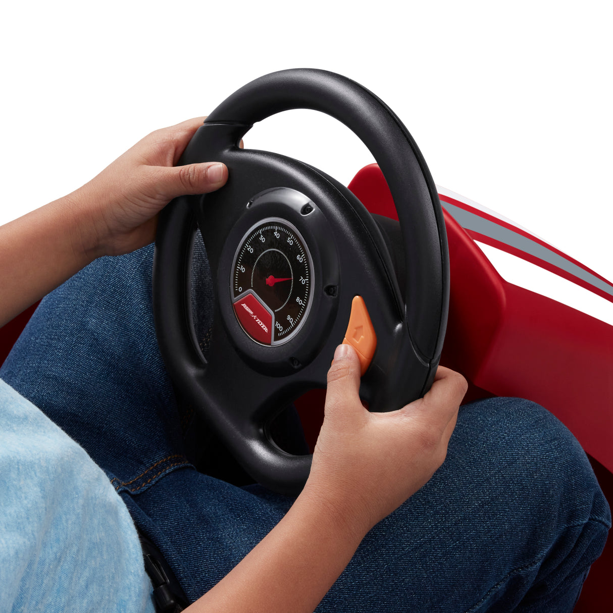 Child pressing the push-button accelerator on the steering wheel for simple one-touch driving