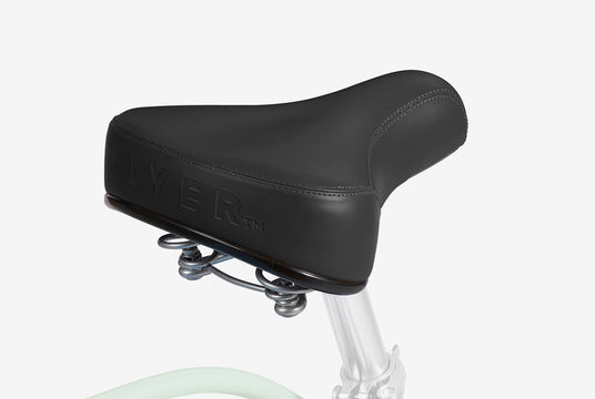 Close up image of a black bicycle seat.