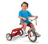 Boy riding Classic Red Dual Deck Tricycle™
