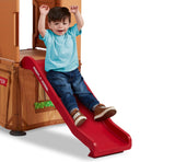 Boy sliding down built-in slide