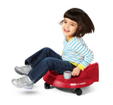 Girl riding Spin â€˜N Saucer®: Ride-On Spin Toy
