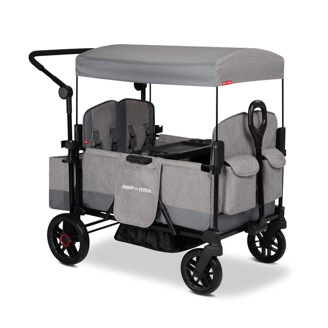Gray four kid stroller wagon with a canopy and rear storage bag on a white background