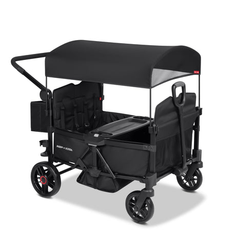 Black four kid stroller wagon with a canopy and rear storage bag on a white background