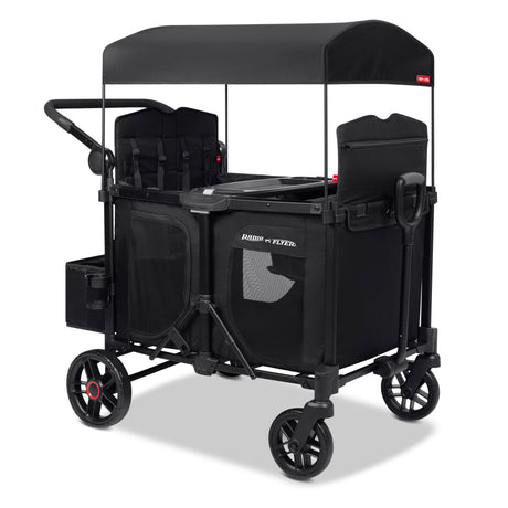 Black four kid stroller wagon with tall sides a canopy and rear storage bag on a white background