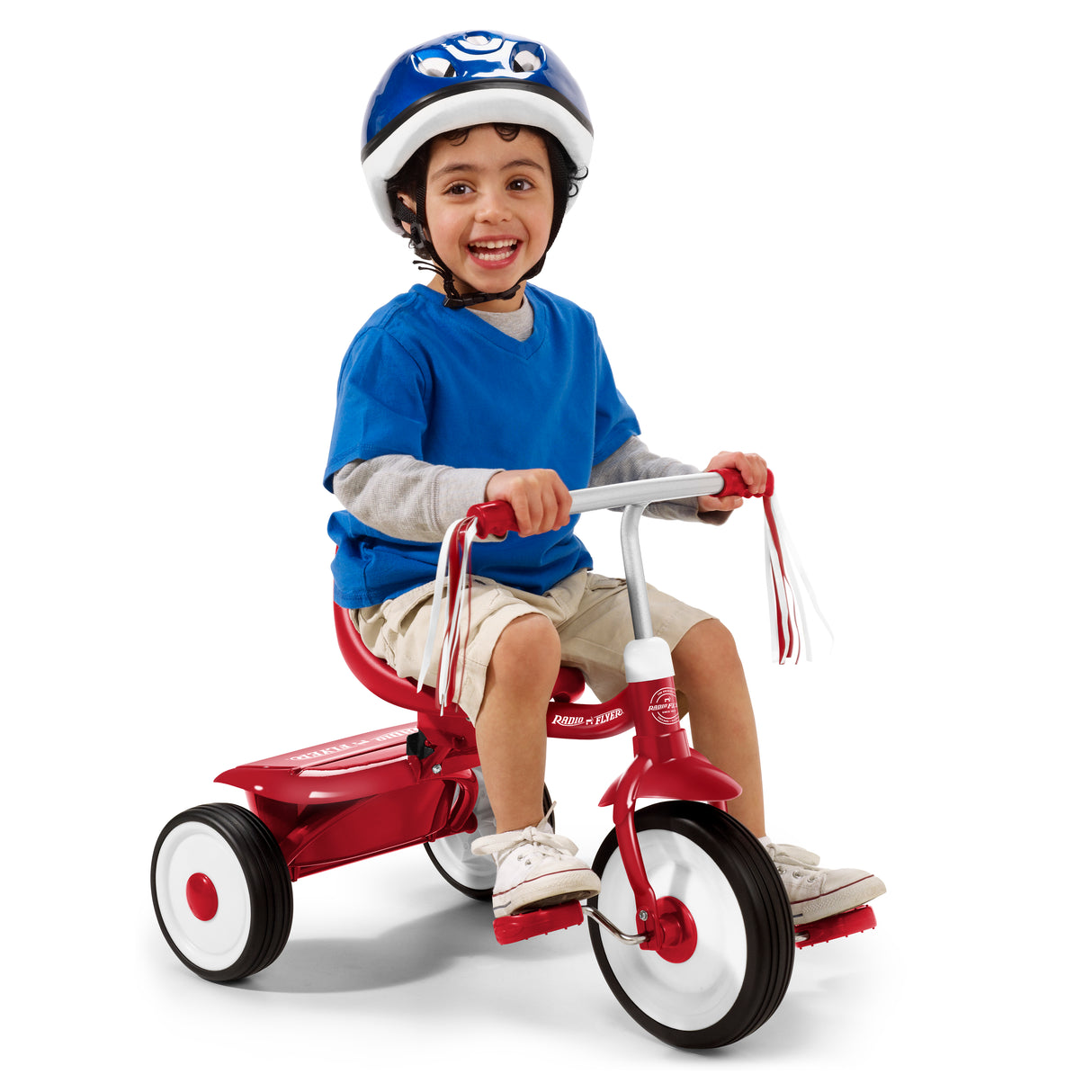 Child riding a red tricycle with a helmet on a white background