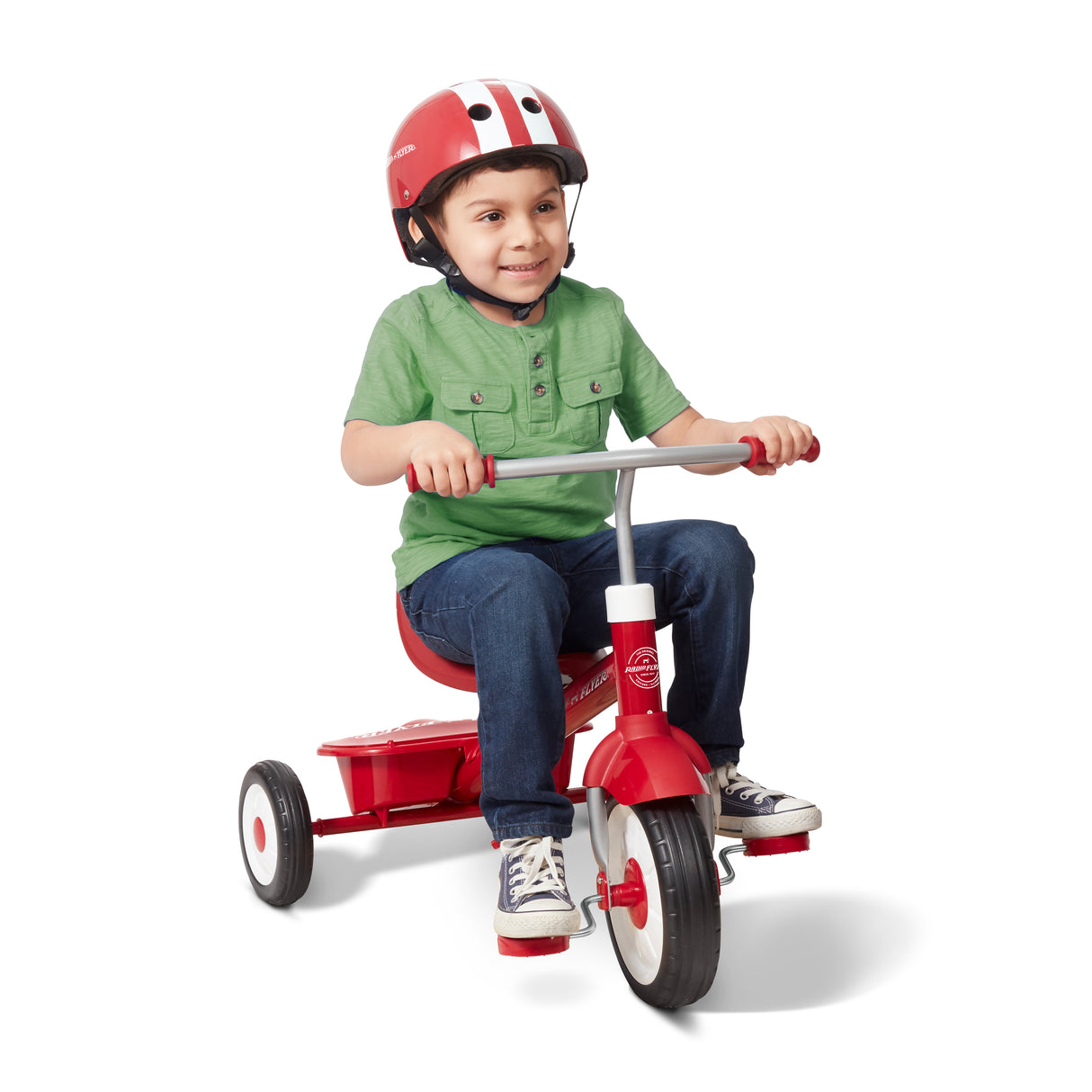A young boy wearing a red and white helmet sits on a red tricycle with three wheels, photographed against a clean white background.