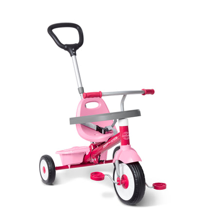 A pink and silver three-wheel tricycle with a push handlebar shown on a white background.