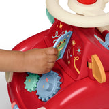 A close-up of a child's hand interacting with the flipping windshield of the red ride-on push car