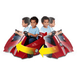 Child riding the Grow With Me Racer while turning the steering wheel to demonstrate the vehicle's 360-degree spinning capability