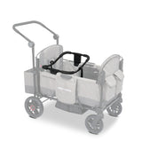 Gray stroller wagon with a car seat adapter resting on the side walls of the wagon