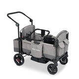 Gray stroller wagon with a car seat adapter resting on the side walls of the wagon