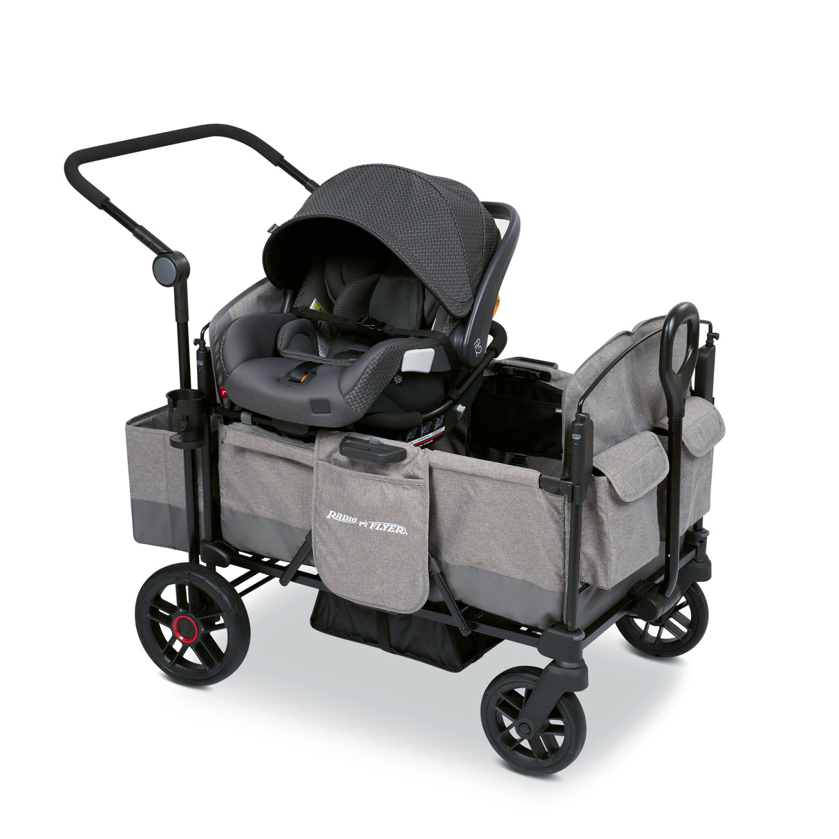 Gray stroller wagon with a car seat resting on the car seat adapter on the side walls of the wagon
