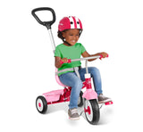 Girl riding 3-in-1 Stroll 'N Trike® Pink in learn to ride mode