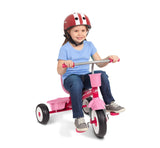 Girl riding Pink 5-In-1 Stroll â€˜N TrikeÂ® in Classic Trike Mode