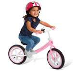 Girl Enjoying A Ride on The Air Ride Balance Bike Pink