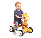 Toddler riding Patches the Giraffe