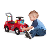 Child playing with the interactive features on the Tinker Truck® with Lights & Sounds